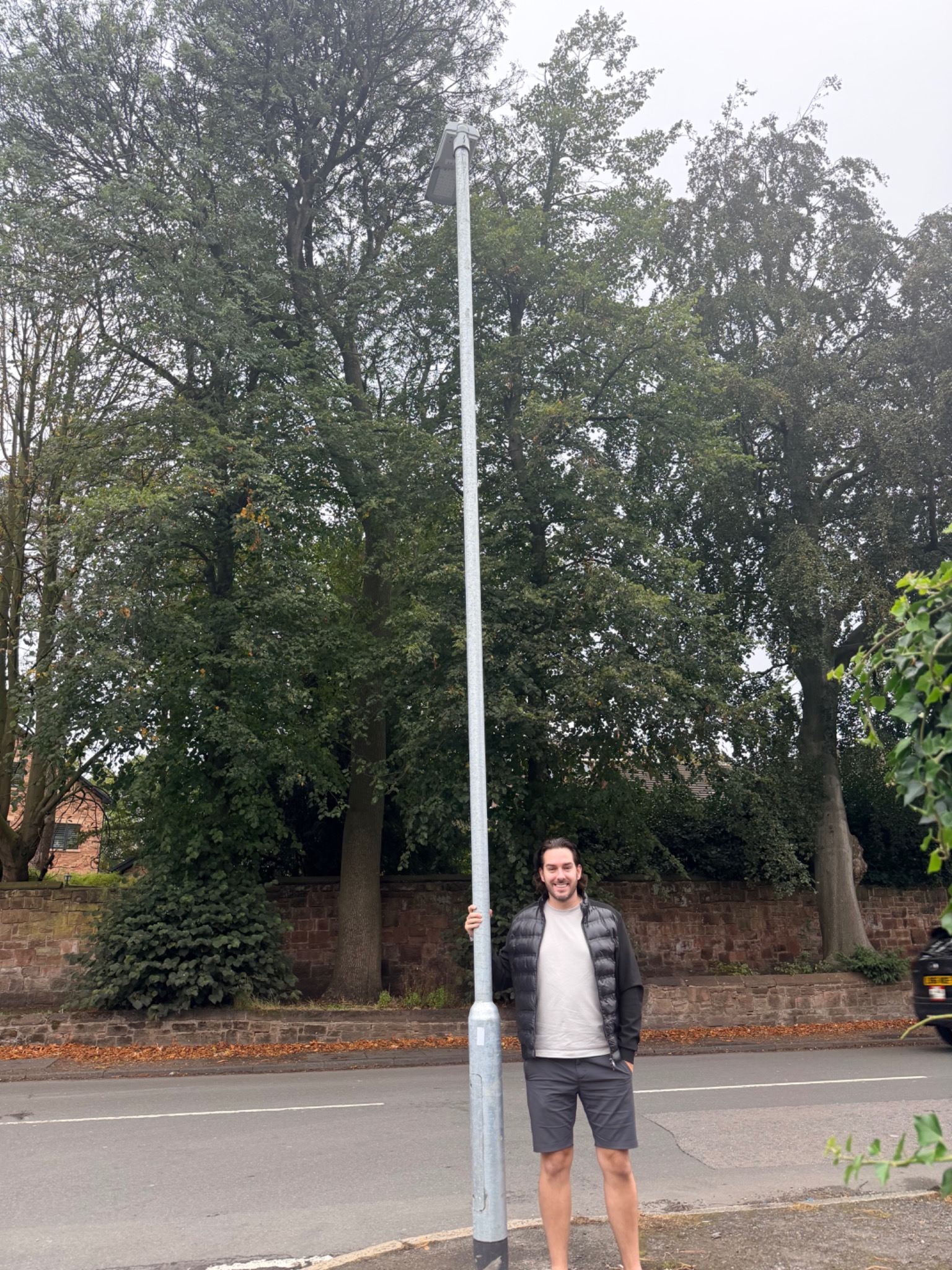 David beside a street lighting column, photographed for the October newsletter