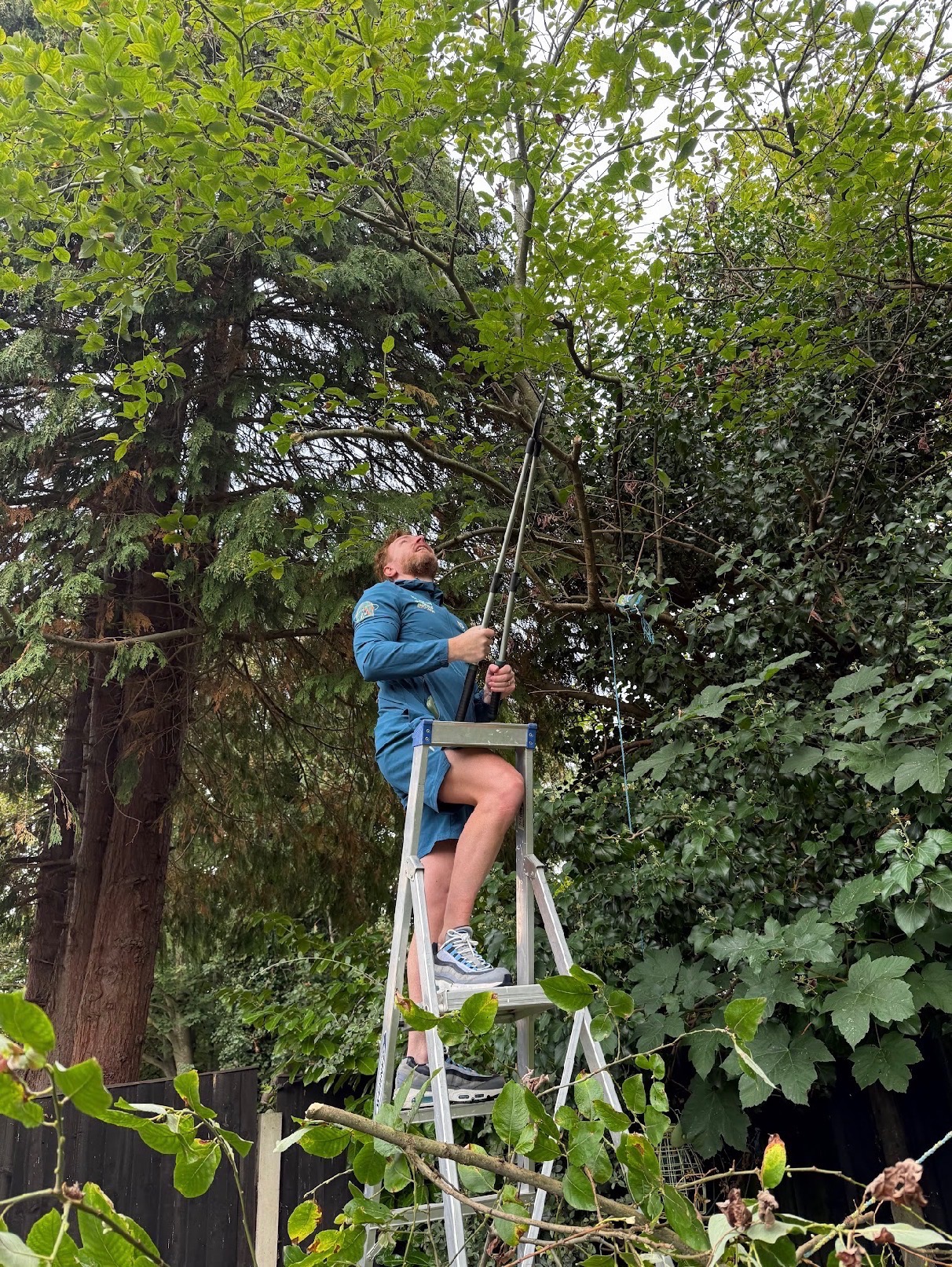 Phil cutting back overgrown branches, as pictured in the October Sandfield Park leaflet